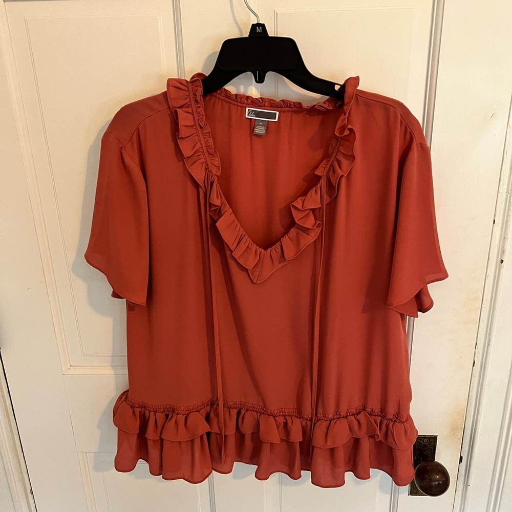 Mauve pink top, chiffon material, size medium.